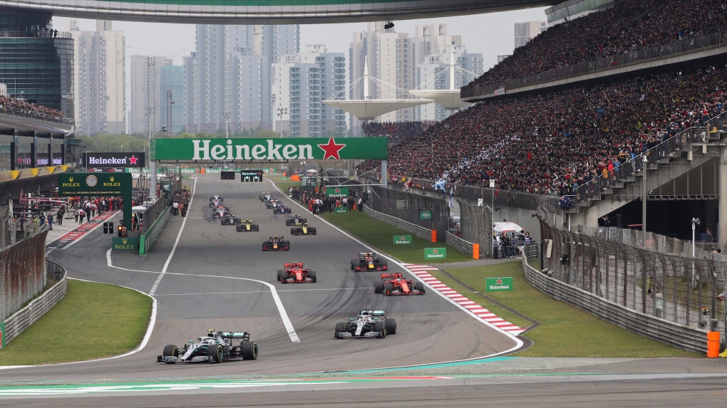 In this Sunday, April 14, 2019, file photo, drivers prepare for the start of the Chinese Formula One Grand Prix at the Shanghai International Circuit in Shanghai, China. Formula One's governing body on Wednesday, Feb. 12, 2020, says Shanghai Grand Prix scheduled for April postponed due to virus. (AP Photo/Ng Han Guan, File) 