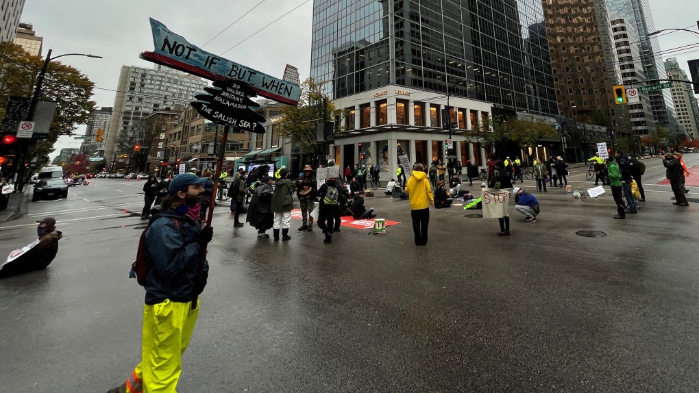 4 arrested during Extinction Rebellion 'die-in' at downtown Vancouver intersection