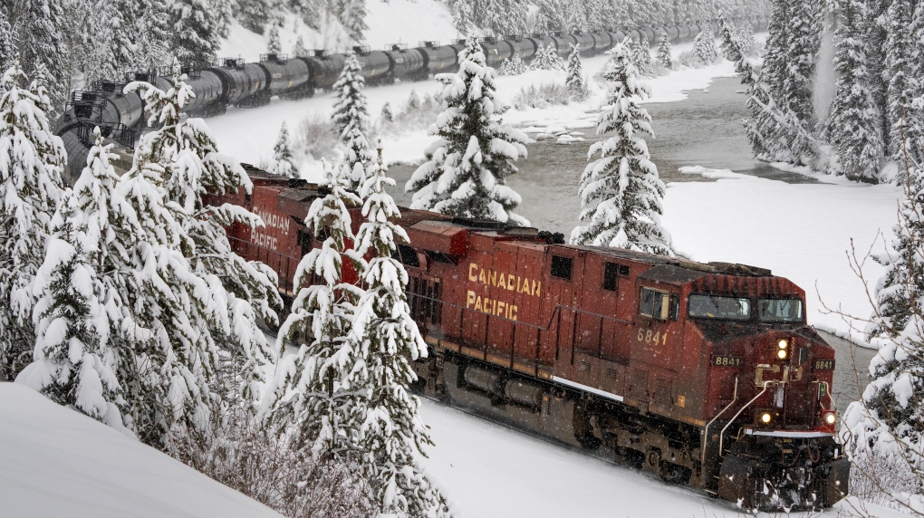 A 3km long Canadian Pacific train hauls oil westward through Banff National Park in Alberta, Canada on Sunday, November 28, 2021. THE CANADIAN PRESS/Frank Gunn