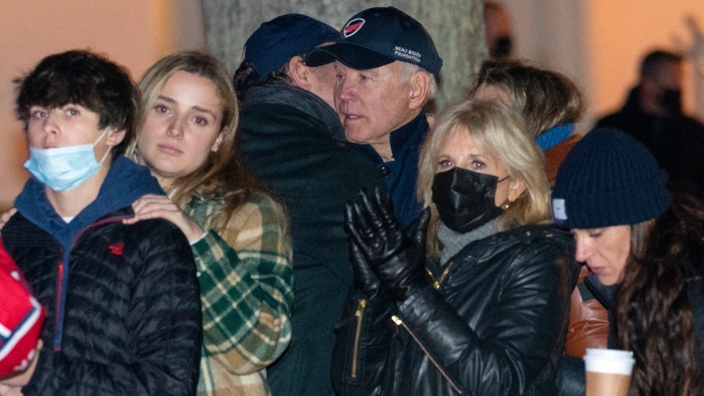 U.S. President Joe Biden is hugged by his son Hunter Biden as they attend the annual Christmas Tree Lighting ceremony with first lady Jill Biden and family in Nantucket, Mass., on Nov. 26, 2021. (Carolyn Kaster / AP) 
