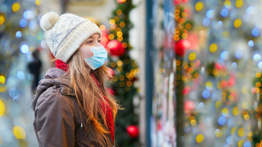 wearing a face mask at a christmas market 1 5700441 1639068984432