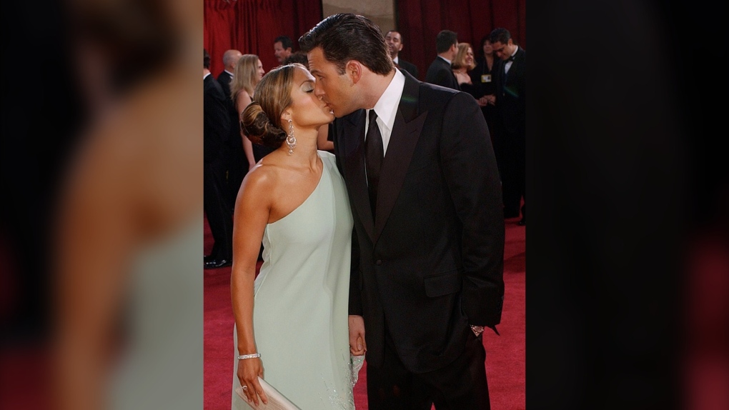 Actors Jennifer Lopez and her then fiance Ben Affleck kiss during their arrival for the 75th annual Academy Awards in this March 23, 2003 taken in Los Angeles. (AP Photo/Kim D. Johnson) 