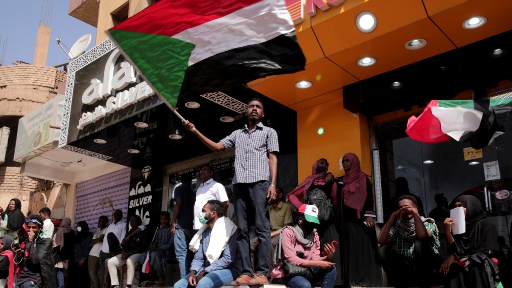 People chant slogans during a protest to denounce the October 2021 military coup, in Khartoum, Sudan, Jan. 9, 2022. (AP Photo/Marwan Ali)