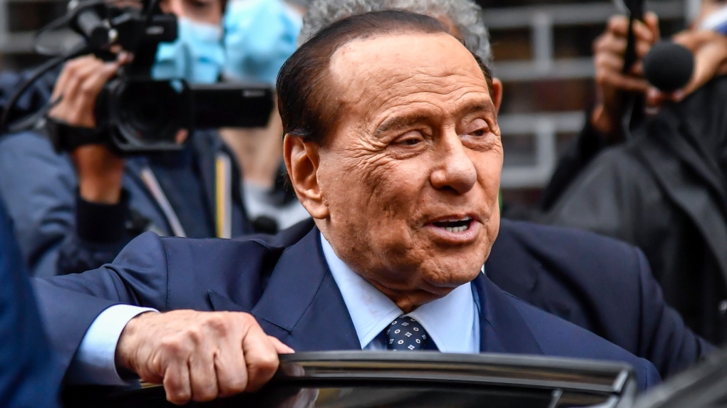 Silvio Berlusconi leaves a polling station in Milan, Italy, on Oct. 3, 2021. The former Italian premier said Russian President Vladimir Putin was "pushed" into invading Ukraine and wanted to put "decent people" in charge of Kyiv, drawing fierce criticism just ahead of Italy's election. (Claudio Furlan/LaPresse via AP)