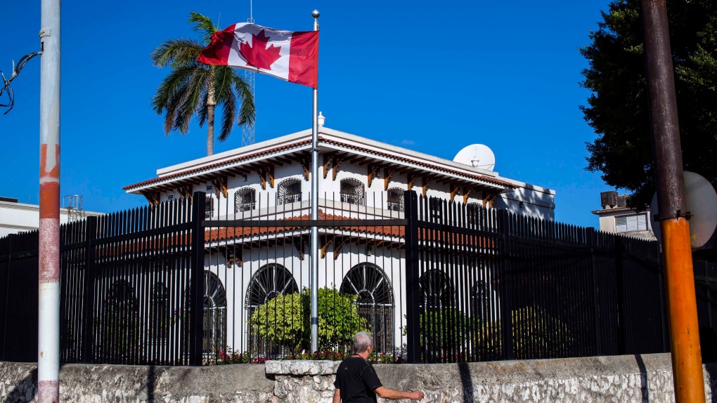 A man walks beside Canada's embassy in Havana, Cuba, Tuesday, April 17, 2018.(AP Photo/Desmond Boylan) 