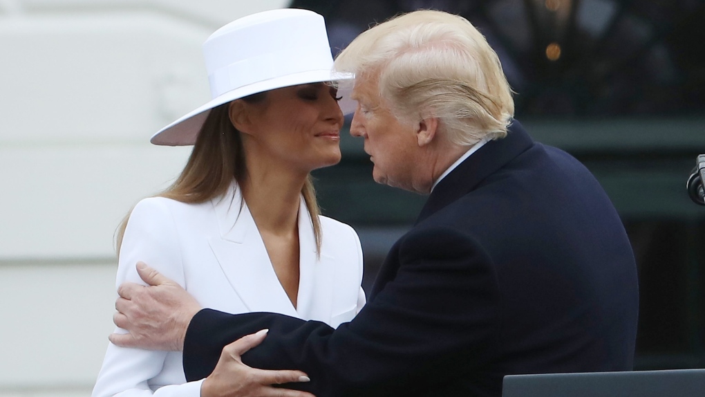 Melania Trump announced Tuesday morning that she is holding an auction of the white hat she wore during the visit of the French first family, the Macrons, to the White House in 2018. (Mark Wilson/Getty Images via CNN)
