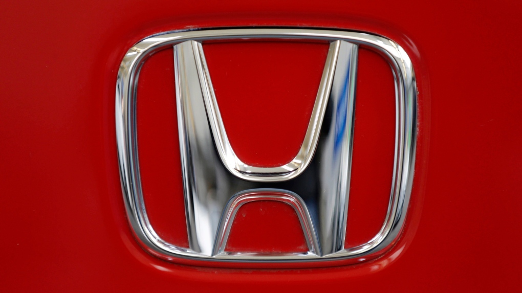 This Feb. 14, 2013, file photo shows a Honda logo on the trunk of a Honda automobile at the Pittsburgh Auto Show in Pittsburgh. (AP Photo/Gene J. Puskar)