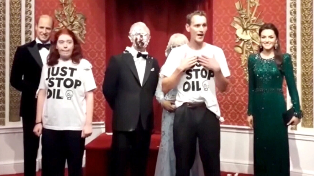 Climate activists smash cakes in face of King Charles III wax statue | CTV  News
