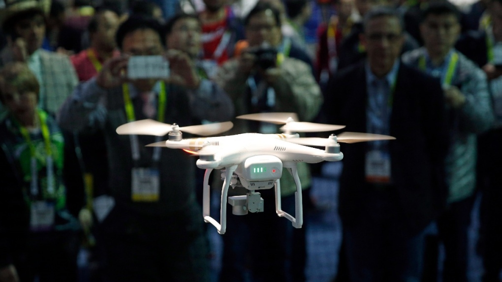 A drone hovers at the DJI booth during CES International in Las Vegas, on Jan. 7, 2016. (John Locher / AP)
