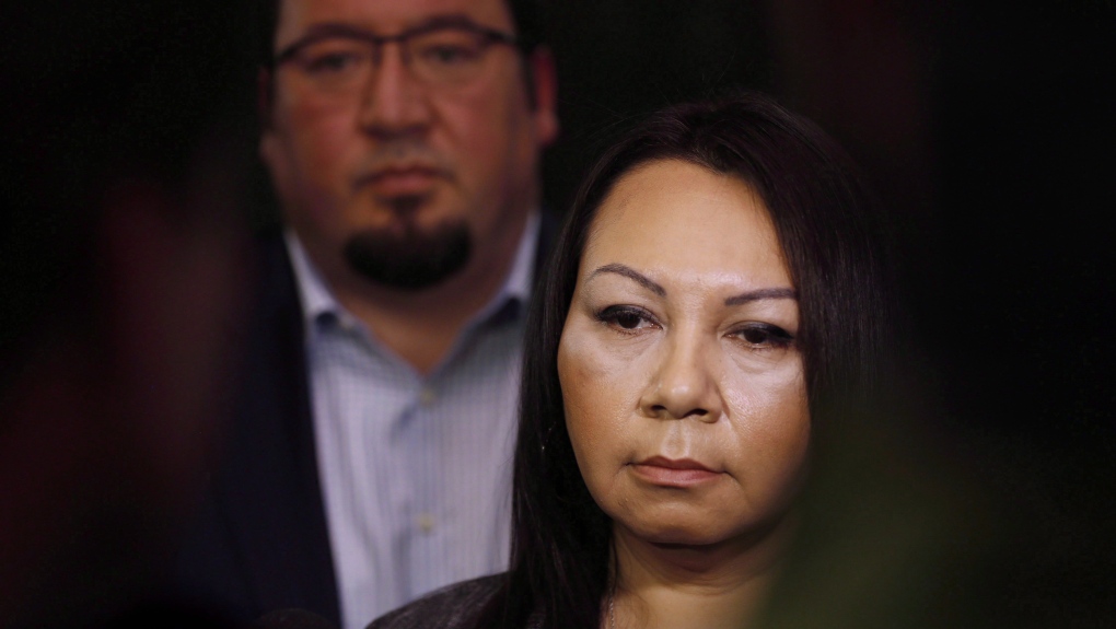 Sheila North Wilson, right, grand chief of Manitoba Keewatinowi Okimakanak, speaks to media as Derek Nepinak, grand chief of the Assembly of Manitoba Chiefs, listens in after RCMP announced at a press conference in Winnipeg, Friday, March 18, 2016. THE CANADIAN PRESS/John Woods