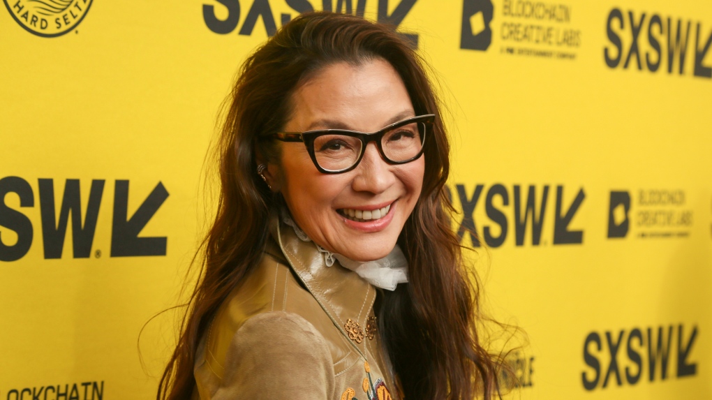 Michelle Yeoh arrives for the world premiere of "Everything Everywhere All at Once," March 11, 2022, in Austin, Texas. (Photo by Jack Plunkett/Invision/AP)