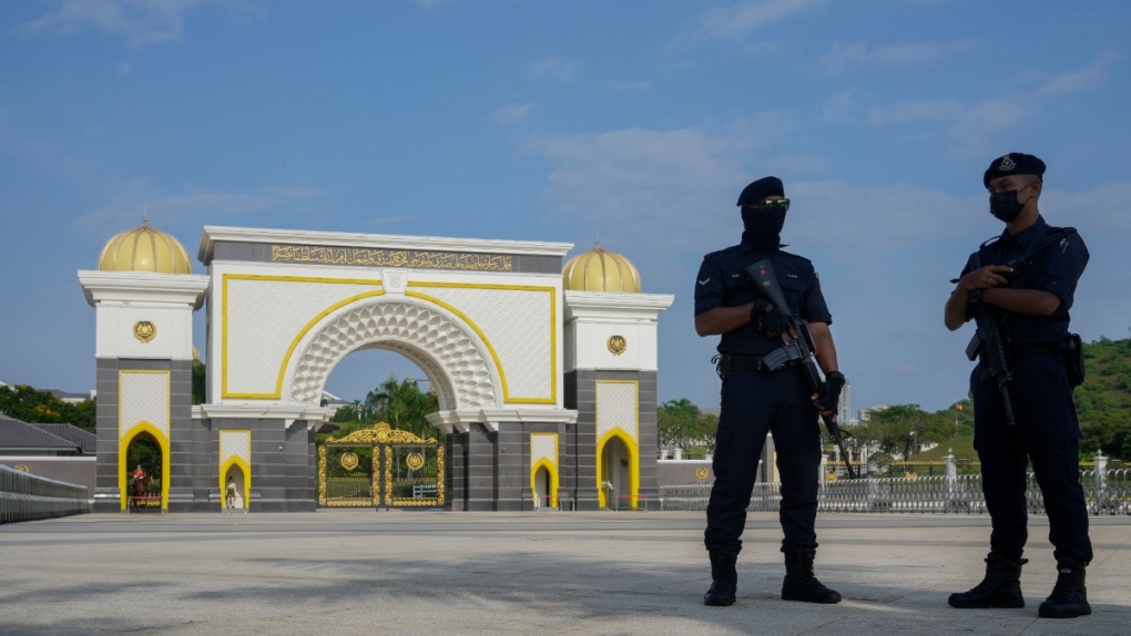Police stand guard at the National Palace in Kuala Lumpur, Malaysia, Nov. 24, 2022. (AP Photo/Vincent Thian)