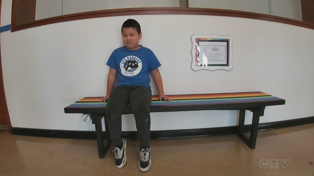 Elementary school students build bench with secret compartment to share messages of kindness