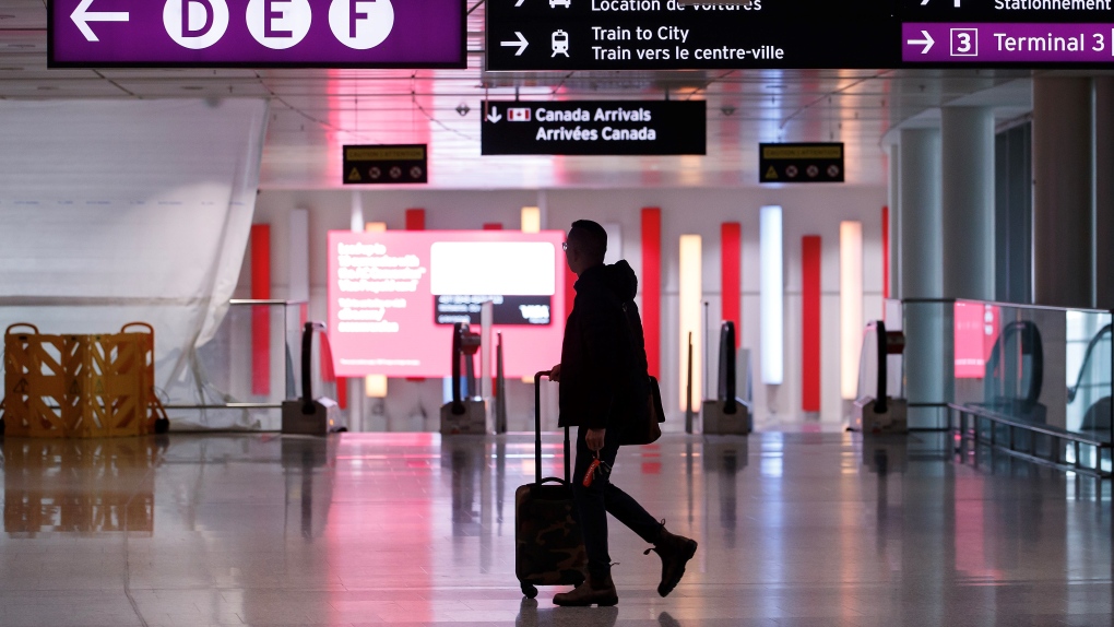Travellers make their way through Pearson International Airport in Toronto Monday, Nov. 14, 2022. THE CANADIAN PRESS/Cole Burston 