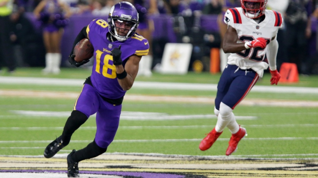 Minnesota Vikings wide receiver Justin Jefferson (18) runs from New England Patriots safety Devin McCourty (32) after catching a pass, on Nov. 24, 2022. (Andy Clayton-King / AP) 