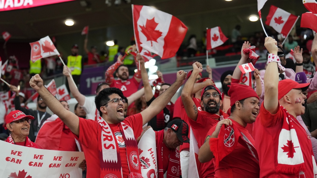Canada fans cheer as the team arrives on the field to warm up ahead of Group F World Cup soccer action against Belgium at Ahmad bin Ali Stadium in Al Rayyan, Qatar, on Wednesday, Nov. 23, 2022. THE CANADIAN PRESS/Nathan Denette