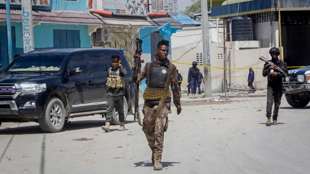 Security forces patrol at the scene, after gunmen stormed a hotel in the capital Mogadishu, Somalia, Aug. 21, 2022. (AP Photo/Farah Abdi Warsameh)