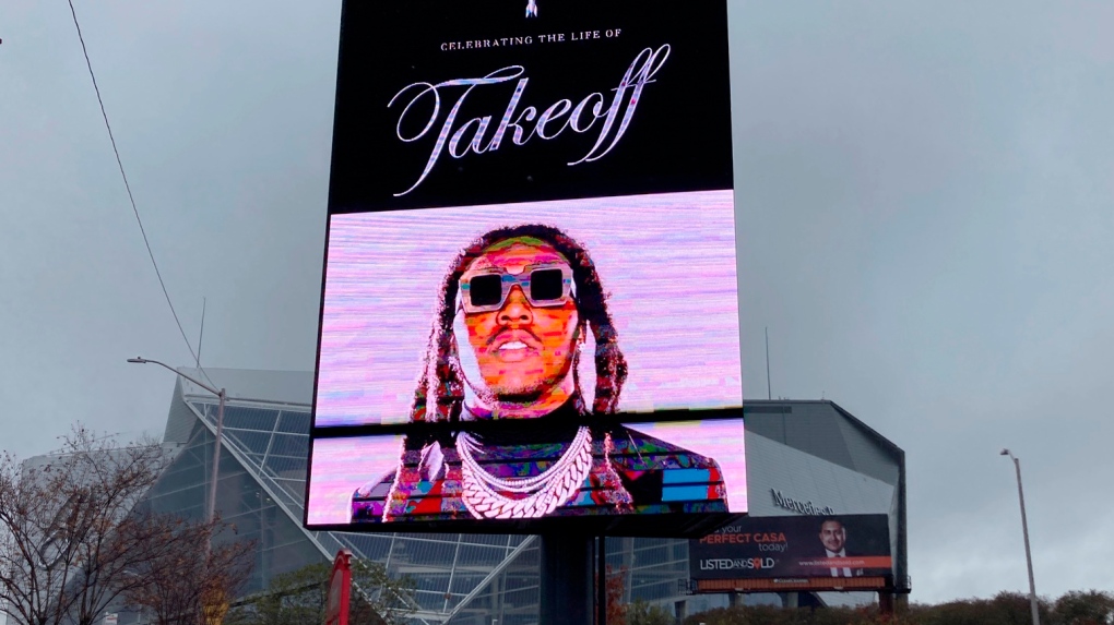 Sign announces the memorial service for slain rapper Takeoff at Atlanta's State Farm Arena on Nov. 11, 2022.  (AP Photo/Sudhin Thanawala)
