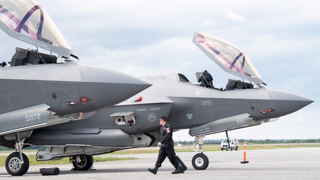 A ground crew member of the F-35A Lightning II fighter demonstration team works on a jet following its arrival at the airport Wednesday September 4, 2019 in Ottawa. The jet is part of a demonstration team in town for a weekend air show. THE CANADIAN PRESS/Adrian Wyld