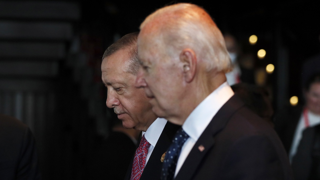 Turkish President Recep Tayyip Erdogan, left, walks with U.S. President Joe Biden during the G20 leaders' summit in Nusa Dua, Bali, Indonesia, Nov. 15, 2022. (Made Nagi/Pool Photo via AP)