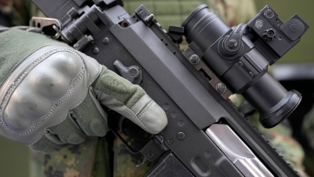 A soldier holds a new M19 rifle made by Serbian armaments company Zastava Arms at an arms fair in Belgrade, on Oct. 12, 2021. (Darko Vojinovic / AP)