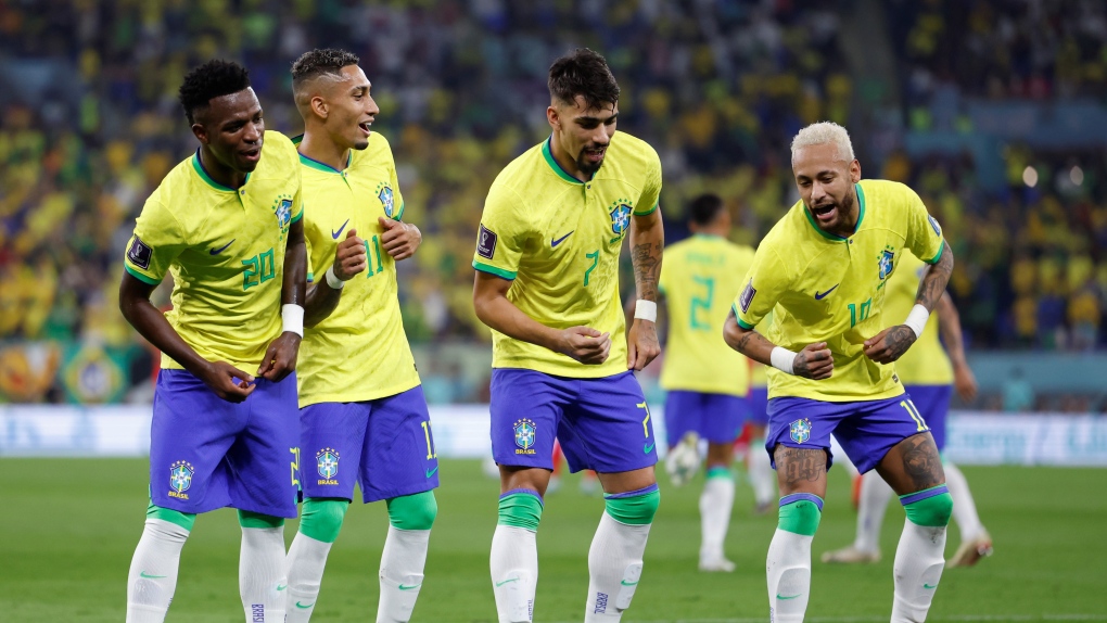 Neymar, right, of Brazil celebrates with Vinicius Junior, left, Raphinha and Lucas Paqueta after scoring a penalty shot during the Round of 16 match between Brazil and South Korea at the 2022 FIFA World Cup at Ras Abu Aboud 974 Stadium in Doha, Qatar, Dec. 5, 2022. (Photo by Wang Lili/Xinhua via Getty Images)