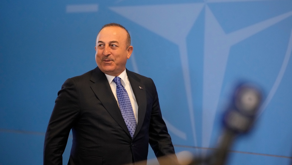 Turkiye's Foreign Minister Mevlut Cavusoglu arrives for the first day of the meeting of NATO Ministers of Foreign Affairs in Bucharest, Romania, Tuesday, Nov. 29, 2022. (AP Photo/Andreea Alexandru)