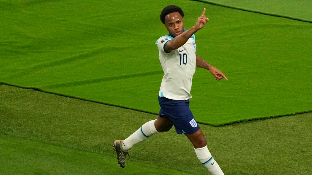 England's Raheem Sterling celebrates after scoring his side's third goal during the World Cup group B soccer match between England and Iran at the Khalifa International Stadium in Doha, Qatar, Monday, Nov. 21, 2022. (AP Photo/Pavel Golovkin)