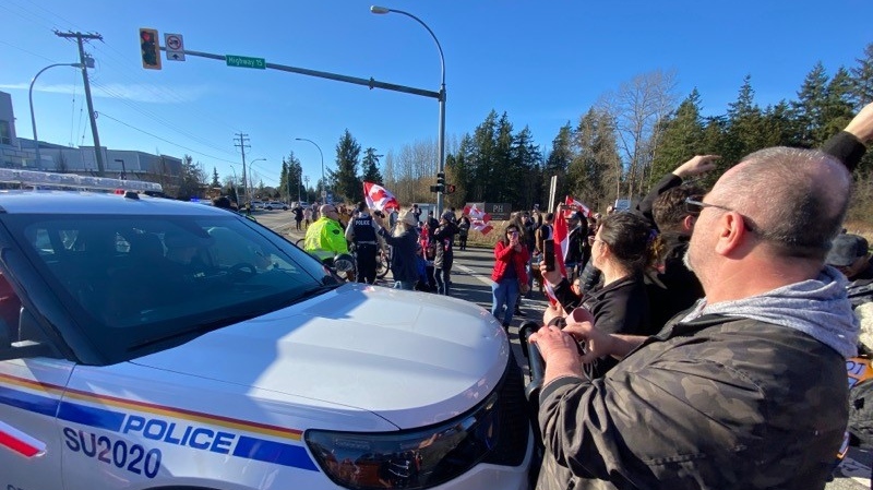 Convoy protesters break through Surrey RCMP barricade with military-style vehicle as others march to U.S. border on foot