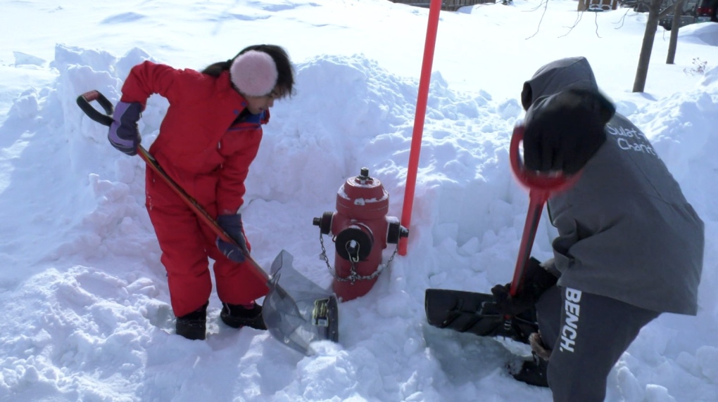 'We're hoping to dig up more': Families take to the snow to uncover buried fire hydrants