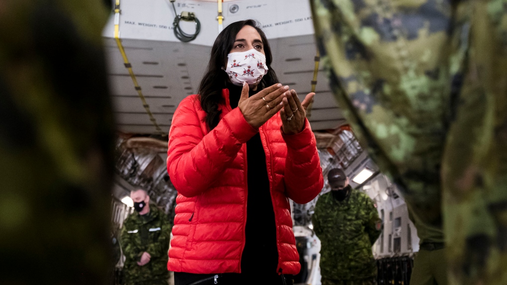 Defence Minister Anita Anand speaks to military personnel after getting a tour of a CC 177 Globemaster aircraft at Canadian Forces Base Trenton, in Trenton, Ont., April 14, 2022. THE CANADIAN PRESS/Christopher Katsarov