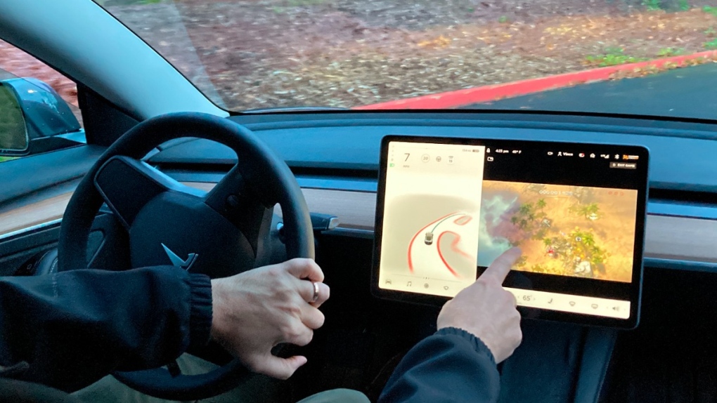 Tesla owner Vince Patton uses the vehicle's computer screen console, on Dec. 8, 2021. (Gillian Flaccus / AP) 