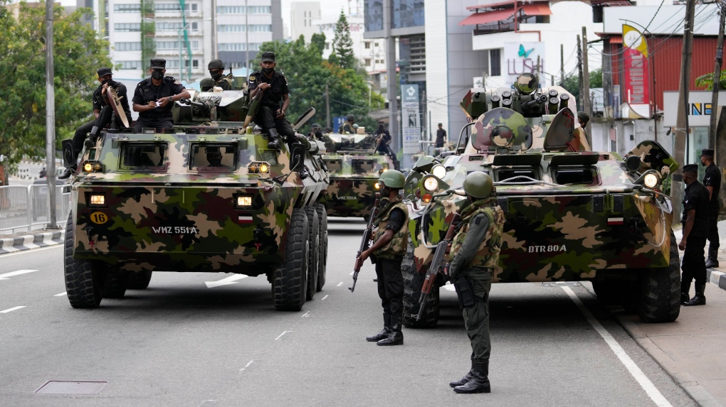 Sri Lankan army soldiers patrol a street in Colombo, Sri Lanka, Saturday, May 14, 2022. (AP Photo/Eranga Jayawardena)