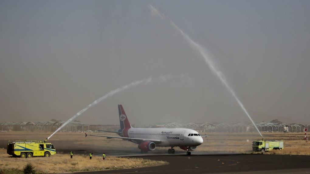 A Yemen Airways plane is greeted with a water spray salute at the international airport in Sanaa, Yemen, on May, 16, 2022. (Hani Mohammed / AP) 