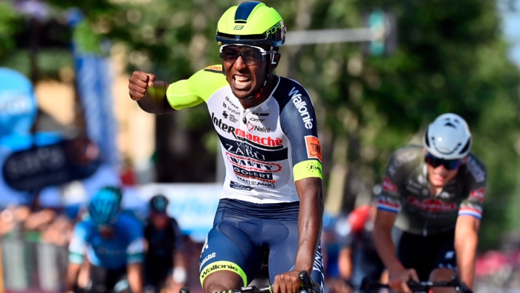 Eritrea's Biniam Girmay celebrates as he crosses the finish line of the 10th stage of the Giro D'Italia cycling race from Pescara to Jesi, Italy, on May 17, 2022. (Massimo Paolone / LaPresse via AP) 