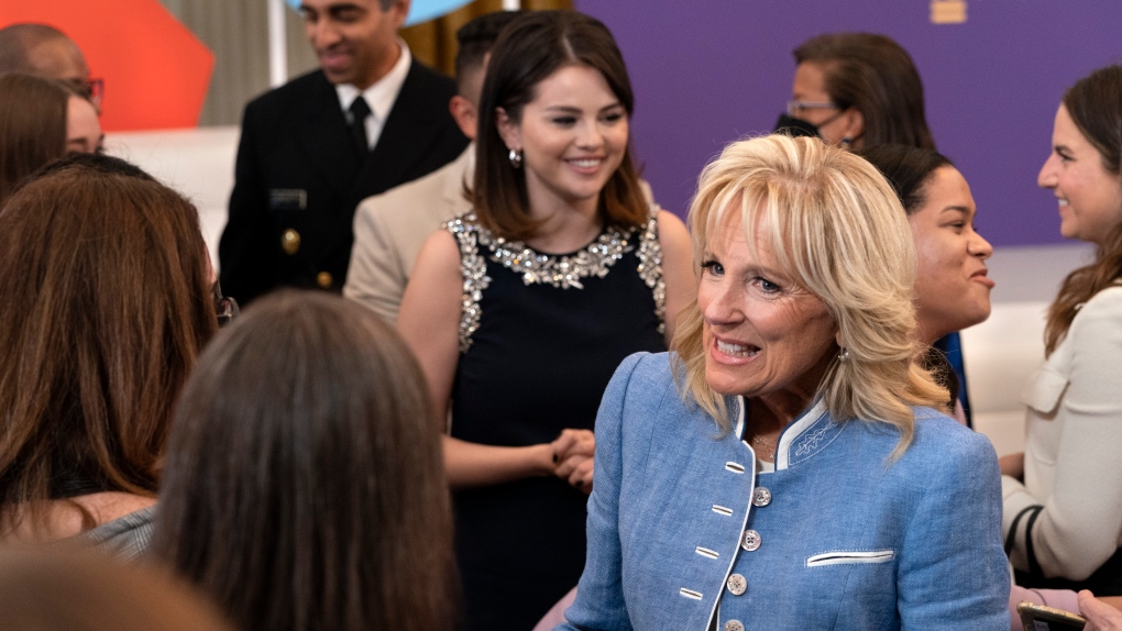 First lady Jill Biden, right, greets people followed by mental health advocate and actress Selena Gomez, after a White House Conversation on Youth Mental Health, with actress Selena Gomez, Wednesday, May 18, 2022, at the White House in Washington. (AP Photo/Jacquelyn Martin)