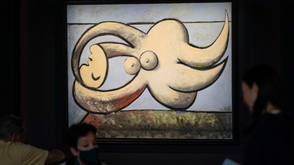 A work by Pablo Picasso entitled 'Femme nue couchee' is displayed at Sotheby's in New York, on May 11, 2022. (Seth Wenig / AP) 