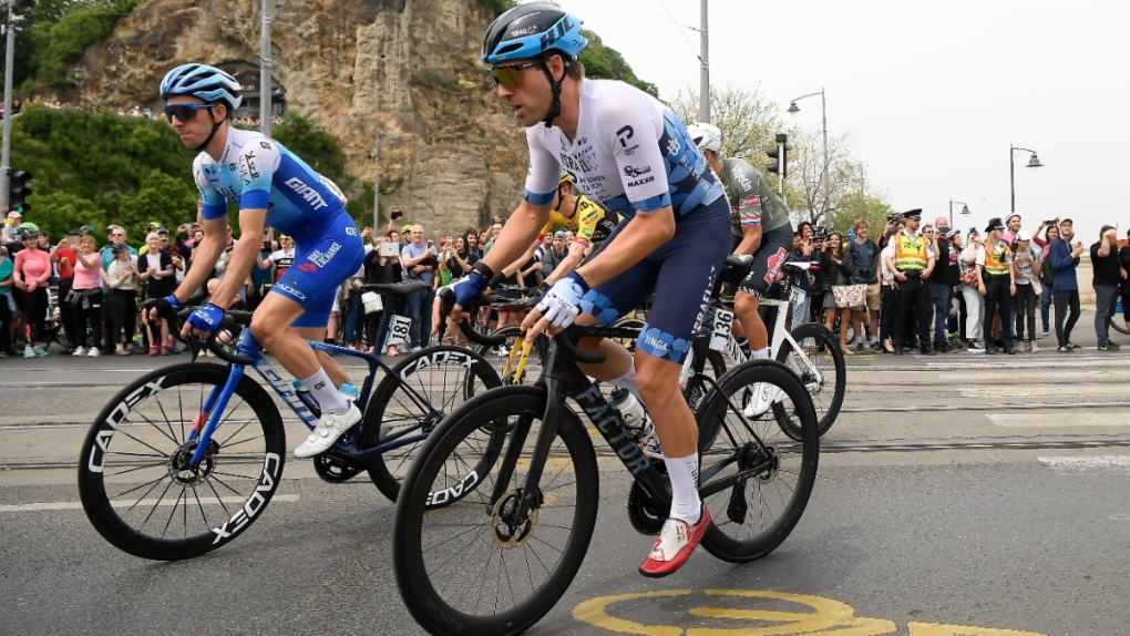 Alex Dowsett of Team Israel-Premier Tech, right, racing at the 105th edition of the Giro d'Italia bicycle race, on May 06, 2022. (Tamas Kovacs / MTI via AP) 