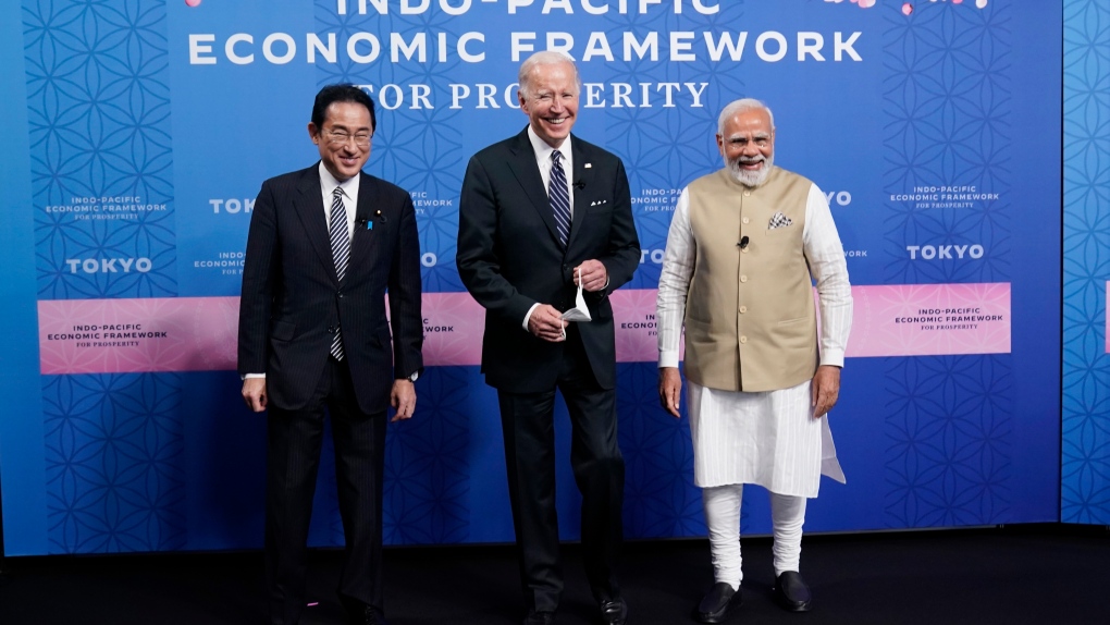 Japanese Prime Minister Fumio Kishida, left, President Joe Biden and Indian Prime Minister Narendra Modi pose for photos as they arrive at the Indo-Pacific Economic Framework for Prosperity launch event at the Izumi Garden Gallery, Monday, May 23, 2022, in Tokyo. (AP Photo/Evan Vucci)