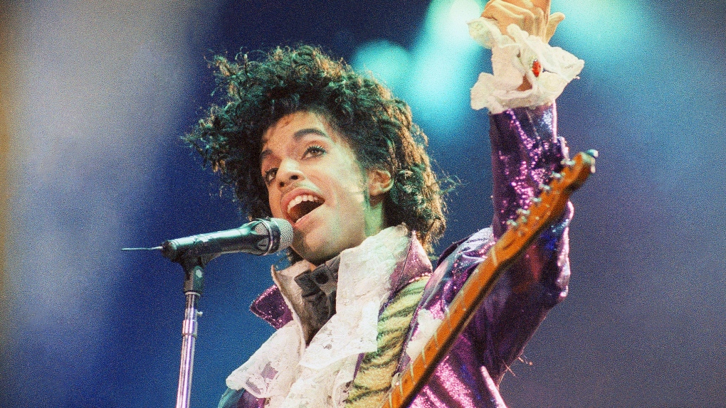 FILE - Prince performs at the Forum in Inglewood, Calif., on Feb. 18, 1985. A reworked and re-released concert that captures Prince & The Revolution at their peak is coming next month. Prince and The Revolution: Liveâ€  will be released June 3 in a variety of formats, including digital streaming platforms, a three-LP vinyl version, a two-CD version and a Blu-ray of the concert film. (AP Photo/Liu Heung Shing, File)