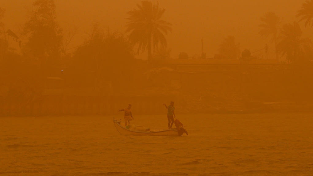 Fishermen navigate on the Shatt al-Arab waterway during a sandstorm in Basra, Iraq, Monday, May 23, 2022. (AP Photo/Nabil al-Jurani)