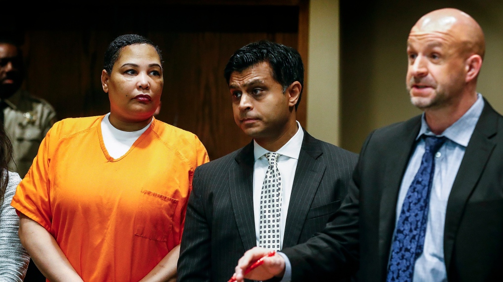 Sherra Wright, left, stands in court as her attorney Juni Ganguli, center, and Assistant District Attorney Paul Hagerman, right, talk to Judge Lee Coffee during a court appearance Friday, Feb. 8, 2019. (Mark Weber/The Commercial Appeal via AP)