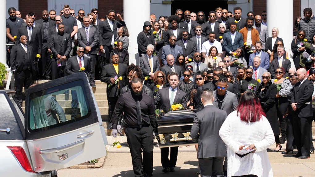 Pallbearers carry the casket of Pittsburgh Steelers NFL football player Dwayne Haskins after a memorial service, Friday, April 22, 2022, in Pittsburgh. (AP Photo/Keith Srakocic)