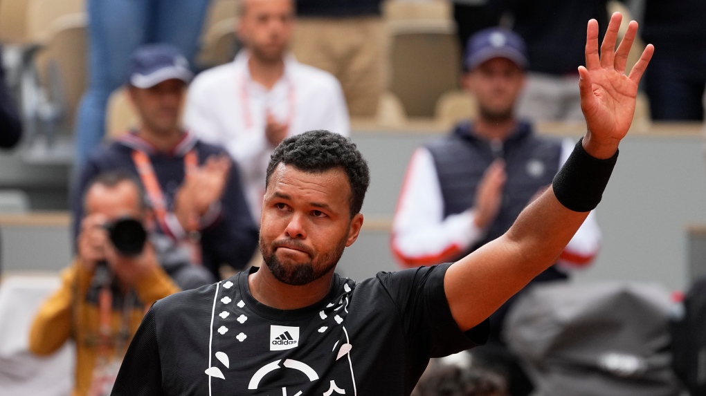 France's Jo-Wilfried Tsonga waves to the public after losing to Norway's Casper Ruud in first round match of the French Open tennis tournament at the Roland Garros stadium Tuesday, May 24, 2022 in Paris. (AP Photo/Michel Euler)