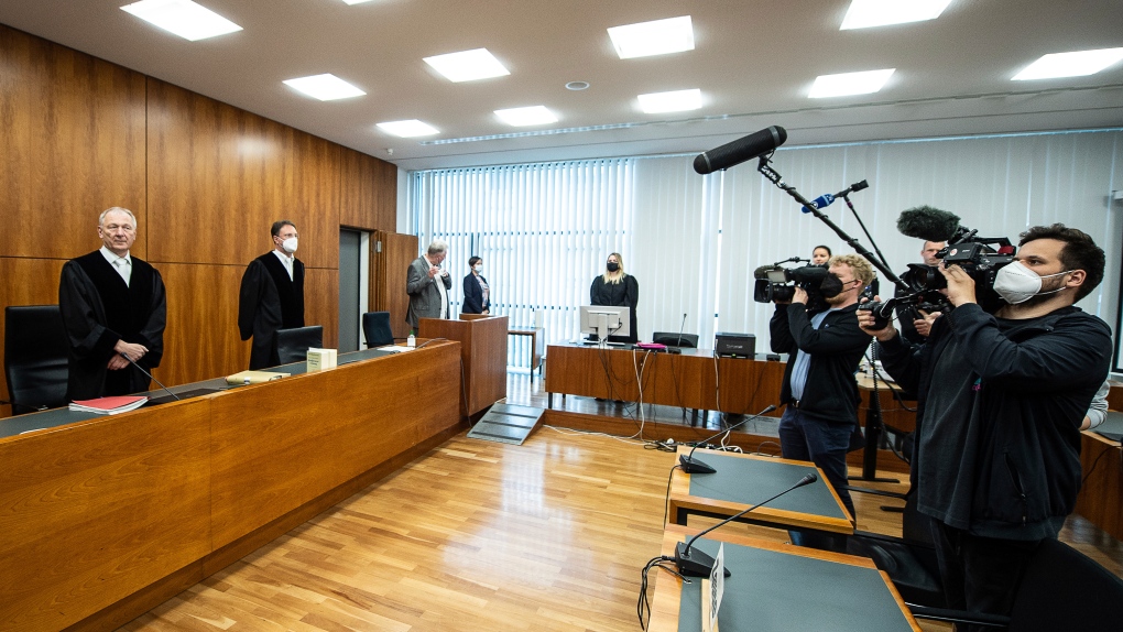 A German court on Wednesday sentenced a woman who posed as a fake doctor and caused the deaths of several of people to life imprisonment for three counts of murder, among other charges. (Swen Pfoertner/dpa via AP)