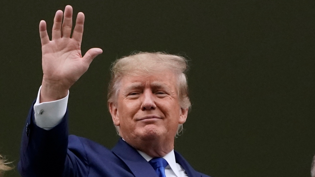 Former U.S. President Donald Trump waves to the crowd as he attends the 148th running of the Kentucky Derby horse race at Churchill Downs Saturday, May 7, 2022, in Louisville, Ky. (AP Photo/Mark Humphrey)