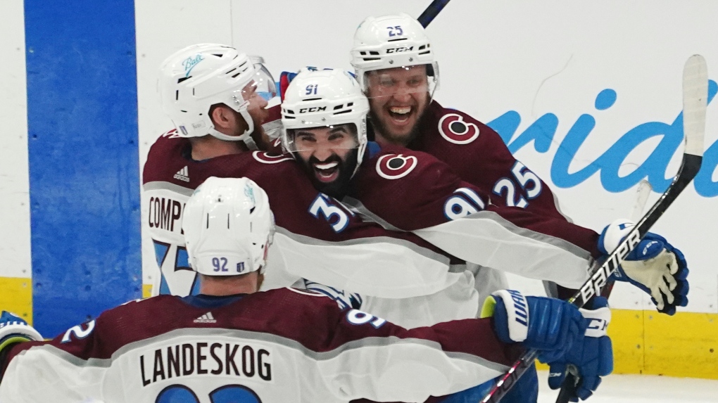 Colorado Avalanche centre Nazem Kadriis congratulated by teammates after his overtime goal against the Tampa Bay Lightning in Game 4 of the NHL's Stanley Cup Final, June 22, 2022, in Tampa, Fla. (AP Photo/John Bazemore)