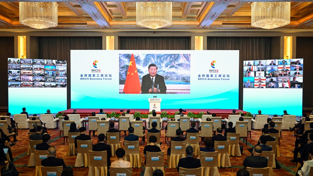 In this photo released by Xinhua News Agency, Chinese President Xi Jinping delivers a keynote speech in virtual format at the opening ceremony of the BRICS Business Forum on Wednesday, June 22, 2022. (Yin Bogu/Xinhua via AP)