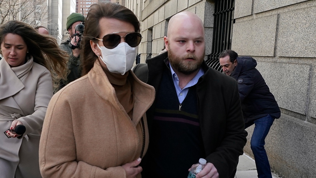 Juror No. 50, right, from the Ghislaine Maxwell trial, leaves federal court, in New York, Tuesday, March 8, 2022. (AP Photo/Richard Drew)