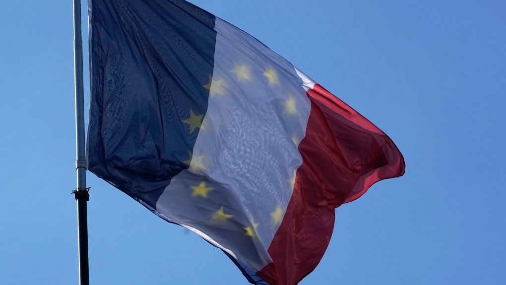 The EU and French flag flap together in the wind prior to leaders arrivals during an EU summit at the Chateau de Versailles, in Versailles, west of Paris, Thursday, March 10, 2022. (AP Photo/Michel Euler)
